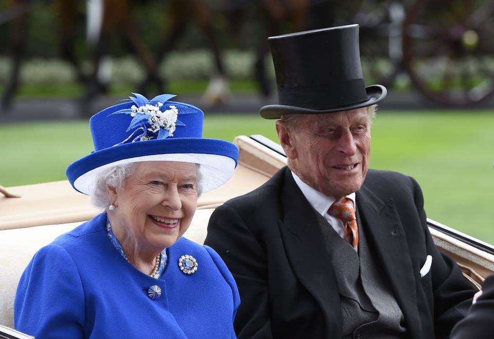 ASCOT, ENGLAND - JUNE 17:  Queen Elizabeth ll and Prince Philip, Duke of Edinburgh arrive in an open carriage to attend day 2 of Royal Ascot on June 17, 2015 in Ascot, England. (Photo by Anwar Hussein/WireImage)