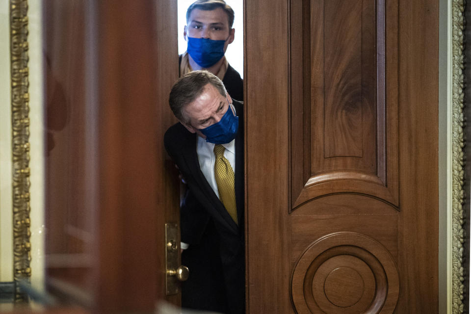 Michael van der Veen, lawyer for former President Donald Trump, looks out from the Senate floor to the Senate Reception room on the fourth day of the Senate Impeachment trials for Trump on Capitol Hill, Friday, Feb 12, 2021 in Washington. (Jabin Botsford/The Washington Post via AP, Pool)