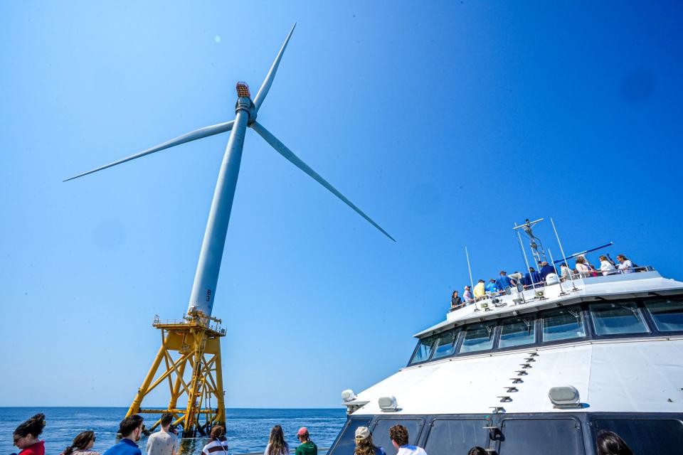 The Rhode Island Fast Ferry circles the turbines of the Block Island Wind Farm during a recent tour.