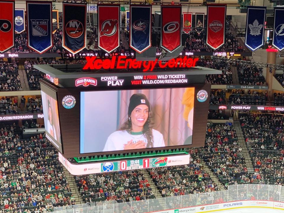 "The Bachelorette" star Michelle Young appears on the video board while attending a recent Minnesota Wild NHL game in St. Paul, Minn. Young played basketball at Bradley University in Peoria.