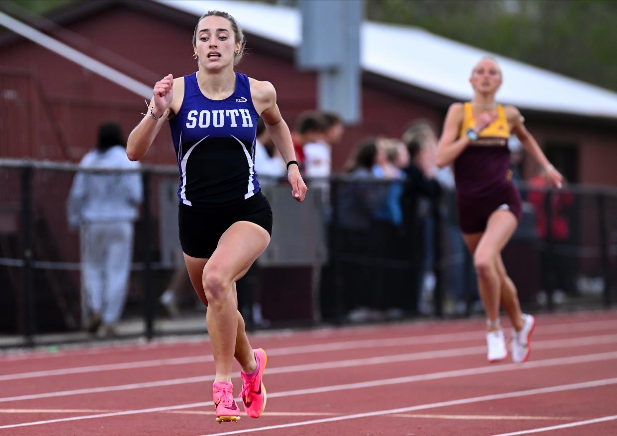 Bloomington South’s Ellie Barada races to a win in the girls' 400 meter dash during the Conference Indiana track meet at Bloomington North on Friday, April 26, 2024.