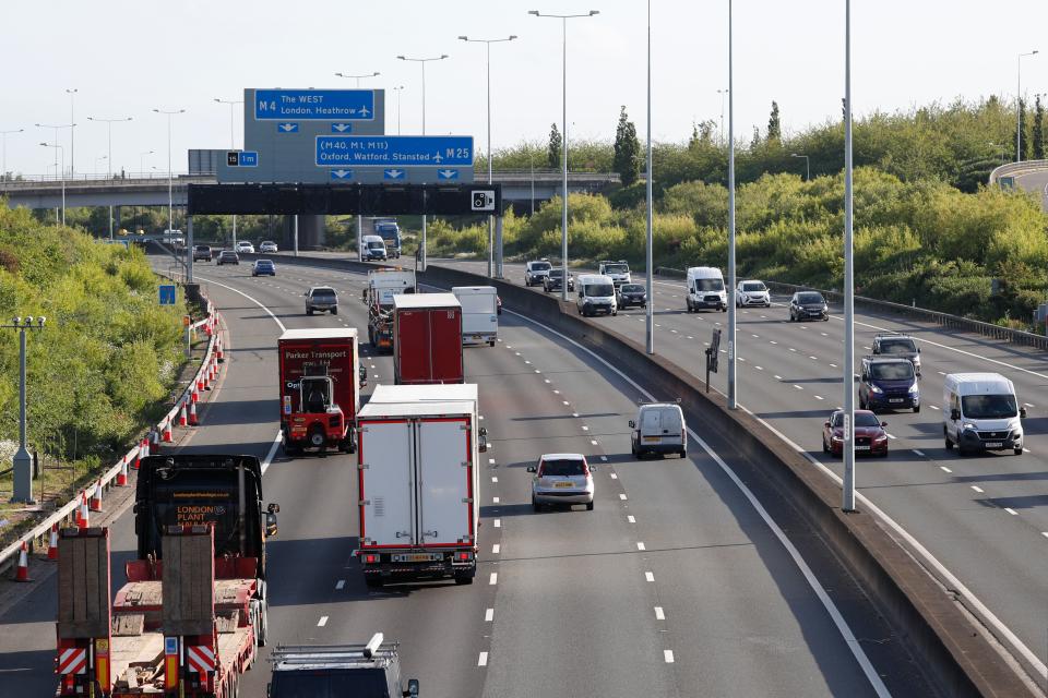 Traffic is seen on the M25 motorway during the morning rush hour near Heathrow Airport in west of London on May 11, 2020. - British Prime Minister Boris Johnson on May 10 announced a phased plan to ease a nationwide coronavirus lockdown, with schools and shops to begin opening from June 1 -- as long as infection rates stay low. (Photo by Adrian DENNIS / AFP) (Photo by ADRIAN DENNIS/AFP via Getty Images)