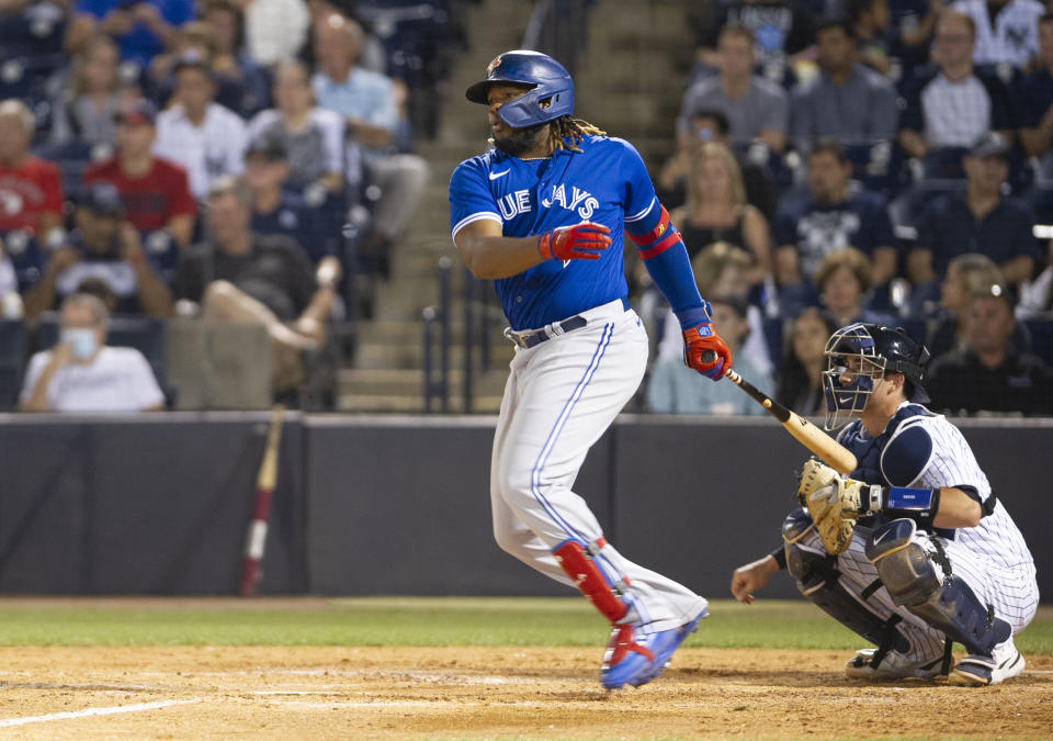 Toronto Blue Jays' Vladimir Guerrero Jr. watches his double against the New York Yankees during a spring training baseball game Wednesday, March 30, 2022, in Tampa, Fla. (Mark Taylor/The Canadian Press via AP)