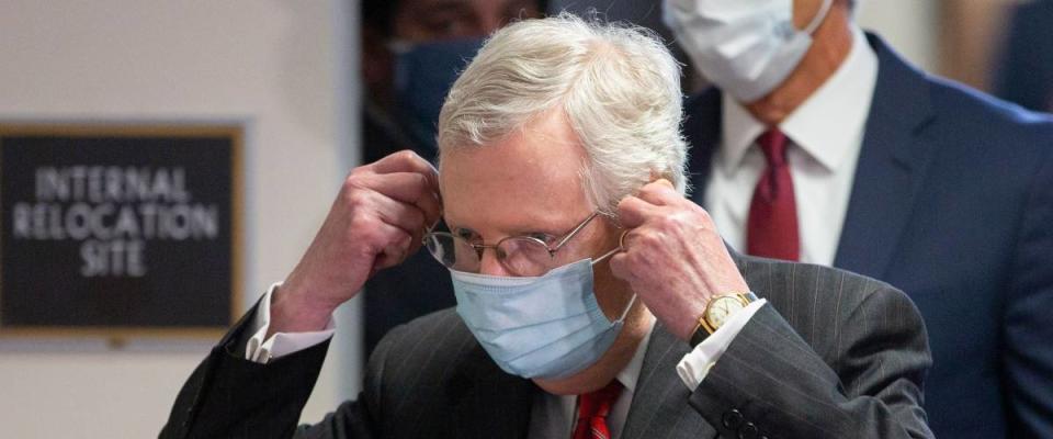 Senate Majority Leader Mitch McConnell takes off a face mask before a news conference, Washington, USA - 05 May 2020.