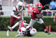 Georgia wide receiver Dominic Lovett (6) is brought down by Ball State defensive back Thailand Baldwin (12) after a catch in the first half of an NCAA college football game Saturday, Sept. 9, 2023, in Athens, Ga. (AP Photo/John Bazemore)