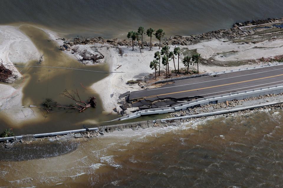 In this aerial view, parts of Sanibel Causeway have washed away along with sections of the bridge after Hurricane Ian passed through the area on Thursday in Sanibel, Florida. The hurricane brought high winds, storm surges, and rain to the area, causing severe damage.