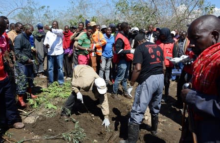 Volunteers attempt to retrieve the bodies of visitors who died in flash floods at the Hell's Gate National Park in Naivasha