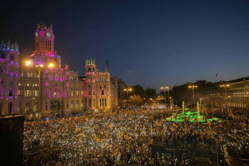 FILE - In this Saturday, March 16, 2019 file photo, Catalan pro-independence demonstrators wave "esteladas," or separatist flags during a rally in Madrid, Spain. A dozen politicians and activists on trial for their failed bid in 2017 to carve out an independent Catalan republic in northeastern Spain will deliver their final statements Wednesday June 12, 2019, as four months of hearings draw to an end. (AP Photo/Bernat Armangue, File)