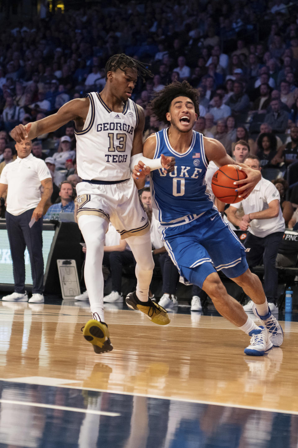 Duke guard Jared McCain (0) drives against Georgia Tech guard Miles Kelly (13) in the first half of an NCAA college basketball game Saturday, Dec. 2, 2023, in Atlanta. (AP Photo/Hakim Wright Sr.)