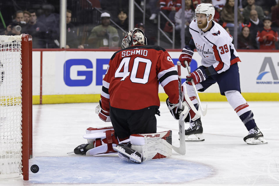 Washington Capitals right wing Anthony Mantha scores a goal past New Jersey Devils goaltender Akira Schmid during the first period of an NHL hockey game Wednesday, Oct. 25, 2023, in Newark, N.J. (AP Photo/Adam Hunger)