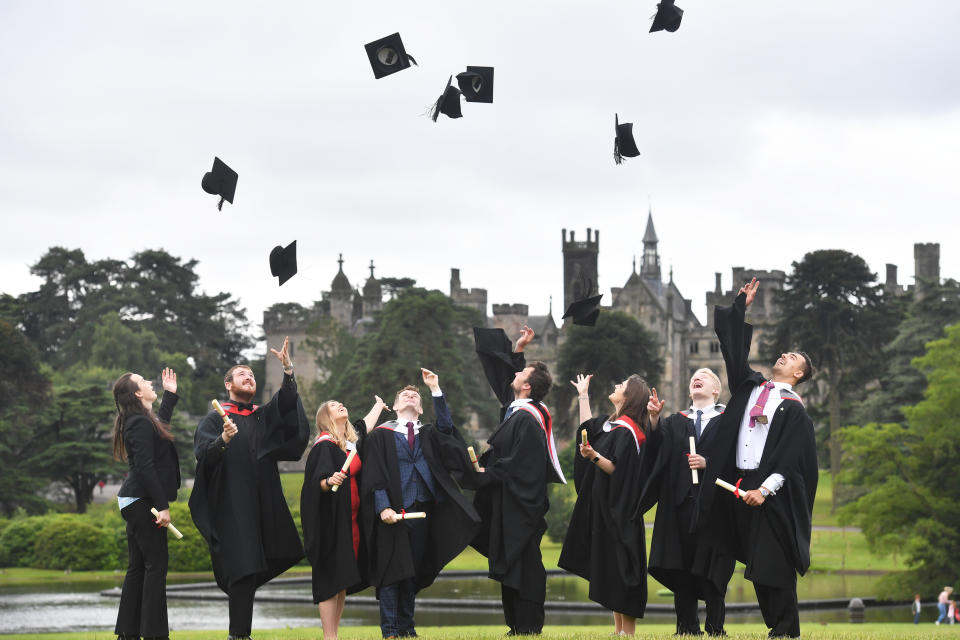 students  Visitor Attraction and Resort Management foundation degree students from Staffordshire University throw their hats into the air after the first graduation ceremony to take place on a rollercoaster at Alton Towers.