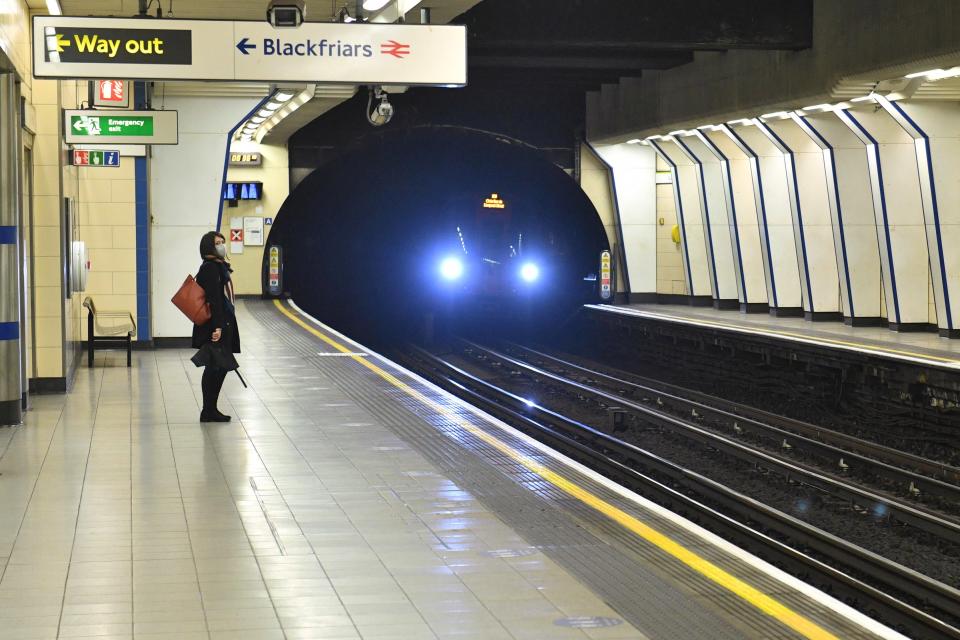 A woman waiting at Blackfriars Tube station (Dominic Lipinski/PA) (PA Archive)