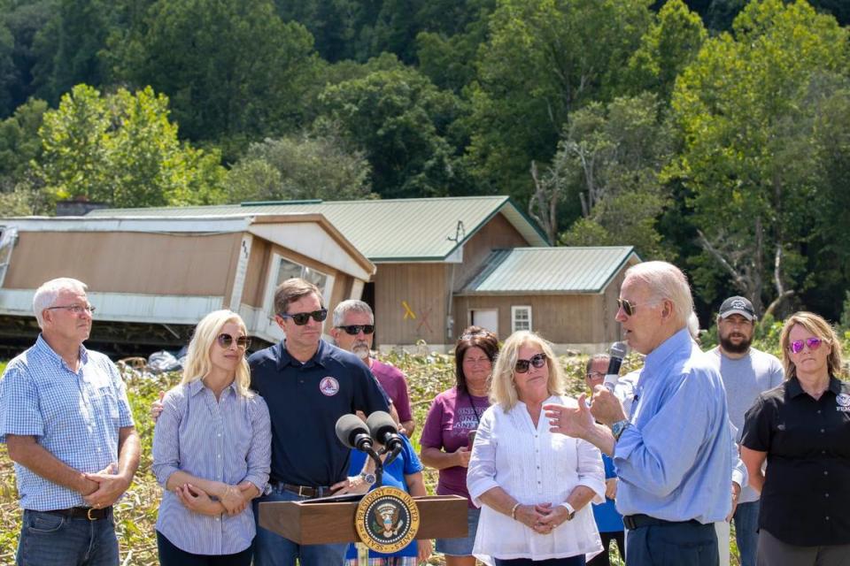 President Joe Biden speaks in Lost Creek, Ky., on Monday, Aug. 8, 2022, about the recovery efforts following flooding in Eastern Kentucky while surrounded by local, state and federal officials and also people whose homes were destroyed in the flooding.