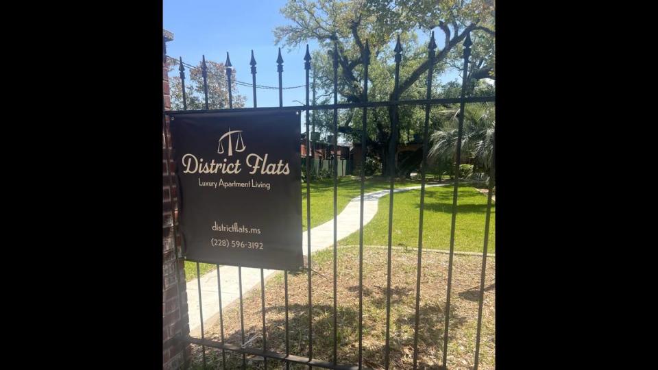 An iron gate adds a touch of New Orleans to District Flats in downtown Pascagoula. The gates and locks at the new luxury apartment are keyless entry, one of the high-tech amenities at the apartments.