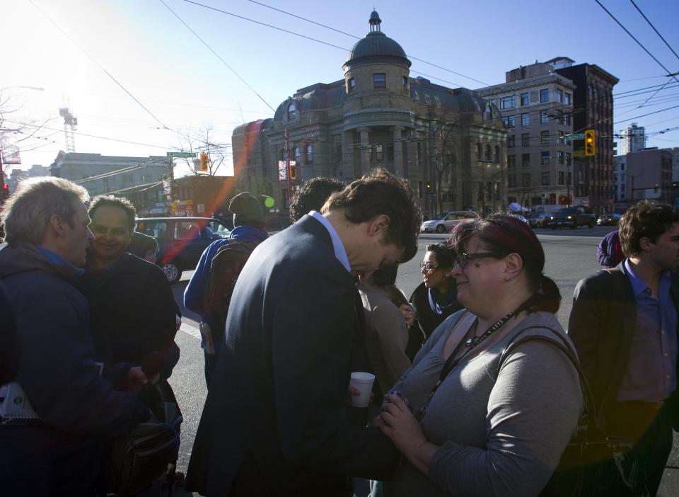 Leader of the Liberal Party of Canada MP Justin Trudeau talks to people in the downtown eastside neighbourhood in Vancouver