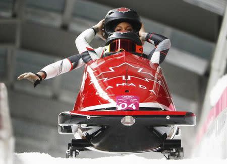 Bobsleigh - Pyeongchang 2018 Winter Olympics - Women's Finals - Olympic Sliding Centre - Pyeongchang, South Korea - February 21, 2018 - Kaillie Humphries and Phylicia George of Canada react. REUTERS/Edgar Su