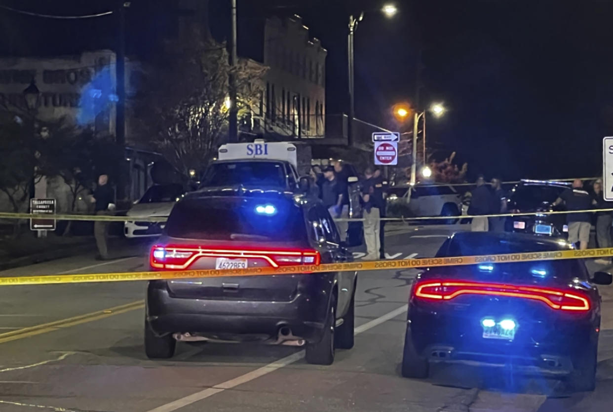 Authorities work on the scene of a shooting in Dadeville, Ala., Saturday, April 15, 2023. (Elizabeth White/WRBL via AP)