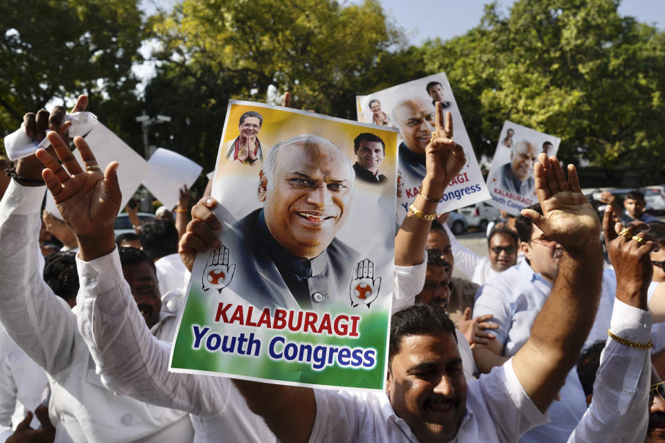 Congress party suppporters celebrate outside the residence of newly elected party president Mallikarjun Kharge in New Delhi, India, Wednesday, Oct. 19, 2022. India’s main opposition Congress party elected Kharge as its new president on Wednesday in a contest in which the dominant Nehru-Gandhi dynasty did not compete. (AP Photo/Manish Swarup)