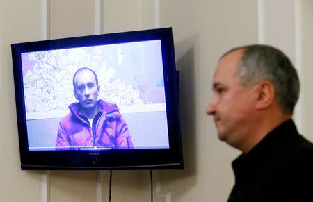 Head of the Security Service of Ukraine (SBU) Vasyl Hrytsak attends a news conference dedicated to the recent detention of two Russian servicemen, whom Ukraine's authorities regard as deserters from the Ukrainian army, with a screen showing one of the detainees according to SBU, in Kiev, Ukraine, November 22, 2016. REUTERS/Valentyn Ogirenko