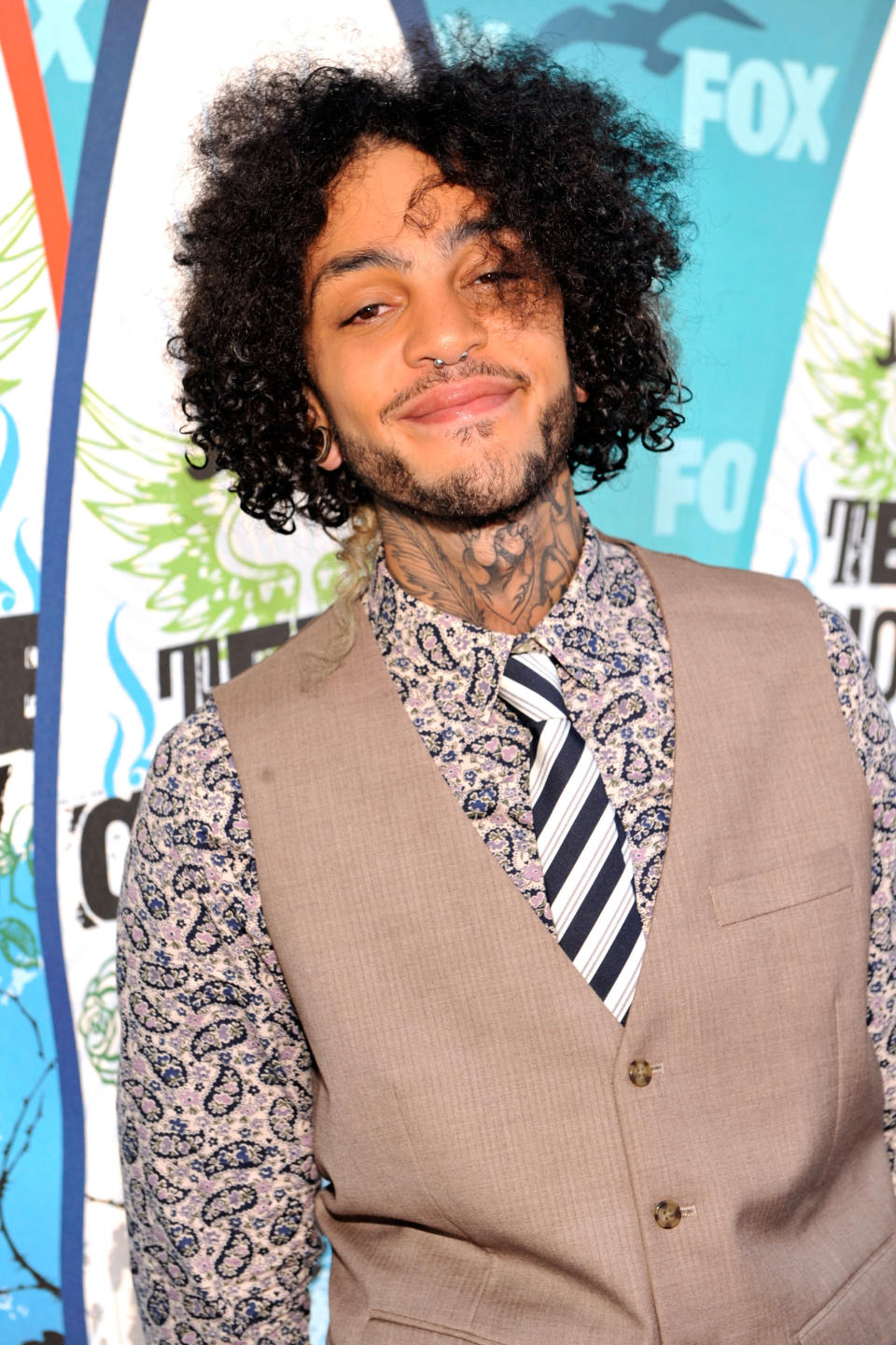 Nose-pierced Travis McCoy is the mesbian who still harps on his ex.