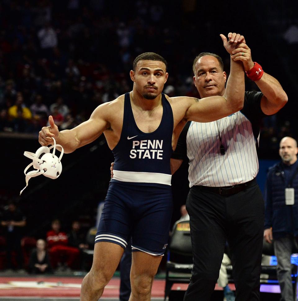 Penn State's Aaron Brooks has his arm raised in victory after defeating Iowa's Zach Glazier 19-3 for the 197-pound title at the Big Ten Wrestling Championships on Sunday, March 10, 2024, in College Park, Md.