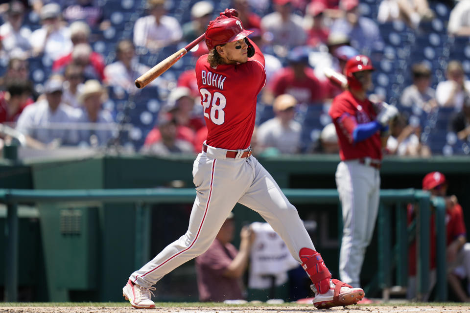 Philadelphia Phillies' Alec Bohm doubles in the third inning of the first game of a baseball doubleheader against the Washington Nationals, Friday, June 17, 2022, in Washington. Nick Castellanos scored on the play. (AP Photo/Patrick Semansky)