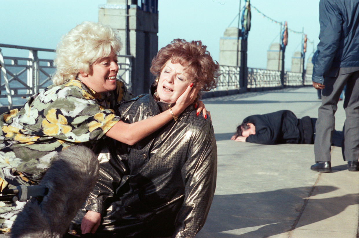 The cast of 'Coronation Street' filming scenes for death of Alan Bradley storyline in Blackpool. Julie Goodyear as Bet Lynch and Barbara Knox as Rita Fairclough. 30th October 1989. (Photo by Andrew Stenning/Mirrorpix/Getty Images)