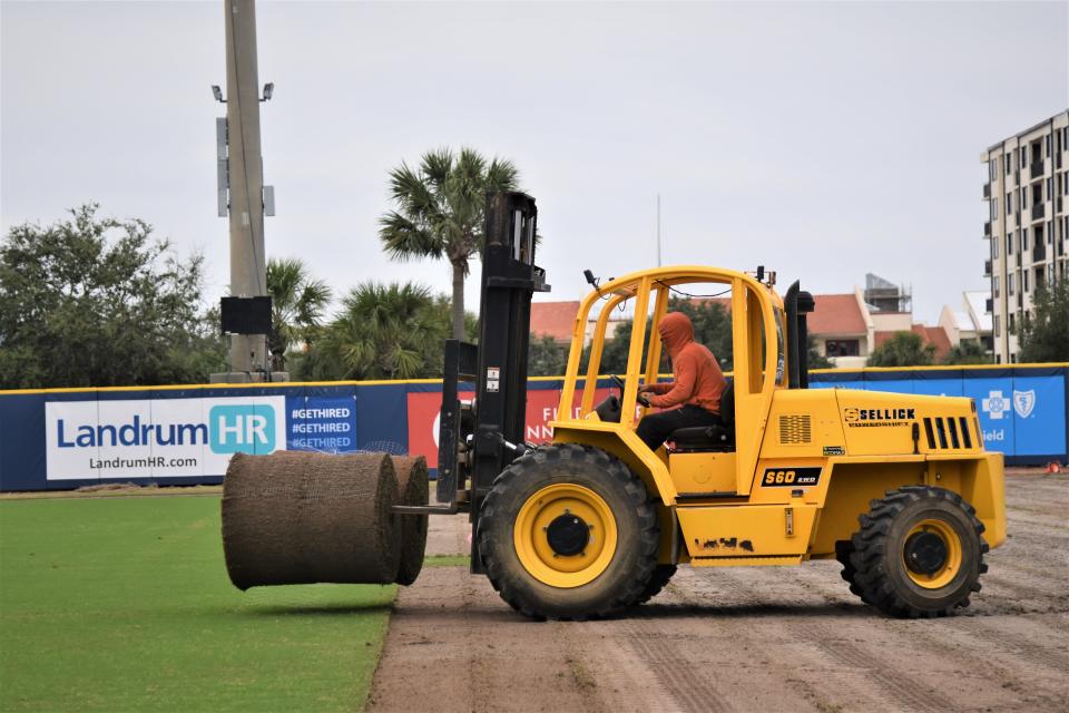 Crews from Craft Turf Farms in Gulf Shores remove the field sod at Blue Wahoos Stadium in preparation for a new synthetic playing surface.