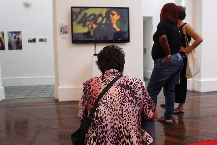 <span class="caption">Visitors watching Laura Murray’s documentary on Gabriela Leite, founder of the prostitution movement in Brazil.</span> <span class="attribution"><span class="source">Amanda De Lisio, Bournemouth University</span></span>