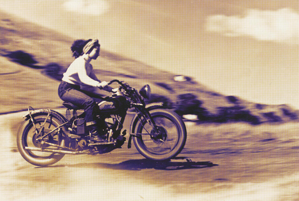 Racing along on an Indian.