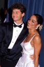 <p>The young stars of "A Different World" arrive together—her in a two-piece white bustier and ruffled skirt, him in a classic tux.</p>