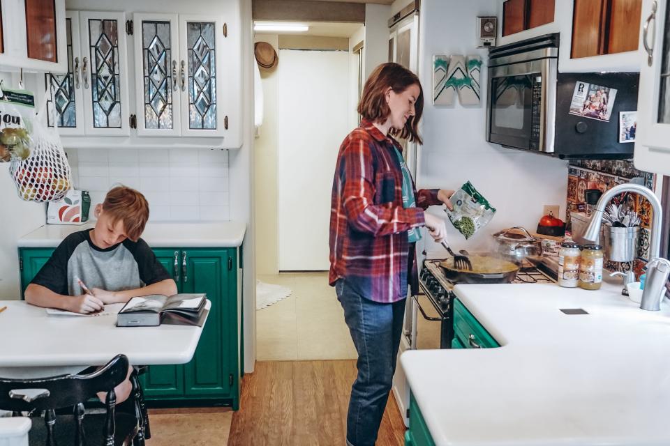 mom and son in the kitchen of walker family RV