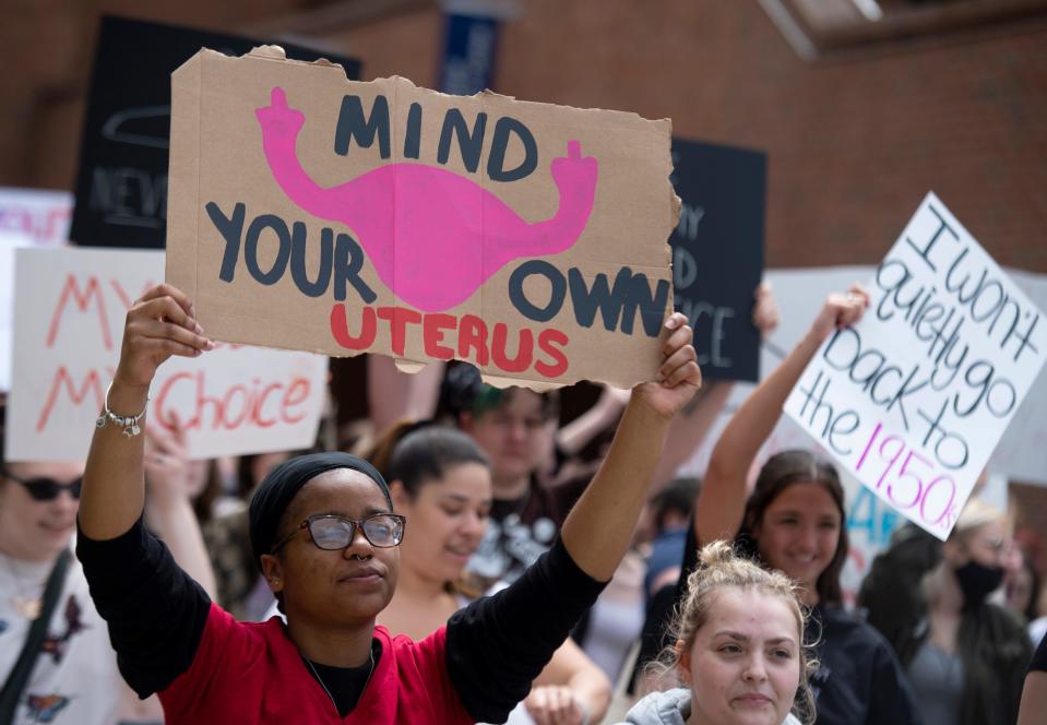 Students for a Democratic Society organized a protest in support of reproductive rights after a leaked Supreme Court decision to overturn Roe v. Wade.  The rally started at Risman Plaza, where the crowd continued to grow, and then marched to the Rock on front campus. The crowd makes way through campus to the Rock on front campus.