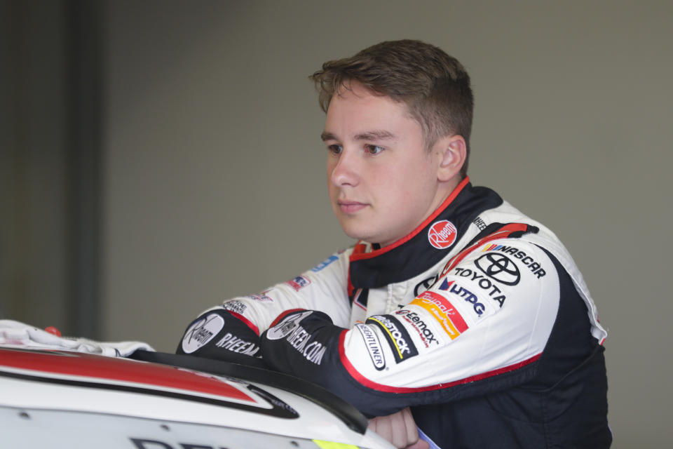 NASCAR Xfinity Series driver Christopher Bell waits in the garage area before the start of NASCAR Xfinity auto racing practice at Indianapolis Motor Speedway, Friday, Sept. 6, 2019 in Indianapolis. (AP Photo/Michael Conroy)