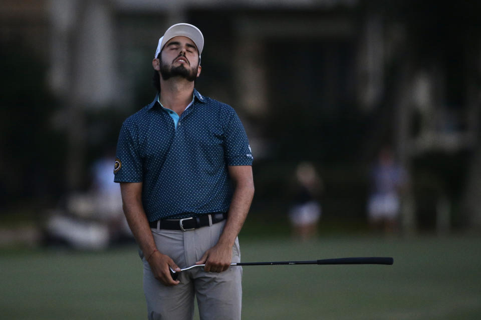 Abraham Ancer reacts after missing a birdie to lose to Webb Simpson by one stroke on the 18th green, during the final round of the RBC Heritage golf tournament, Sunday, June 21, 2020, in Hilton Head Island, S.C. (AP Photo/Gerry Broome)