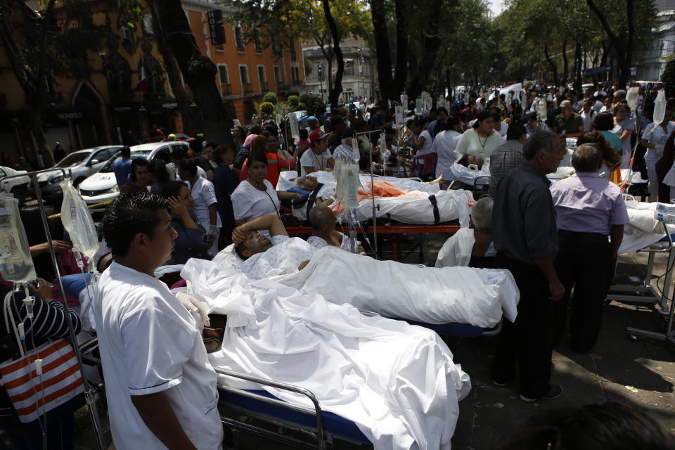 <p>Patients lie on their hospital beds after being evacuated following an earthquake in Mexico City, Tuesday, Sept. 19, 2017. A powerful earthquake jolted central Mexico on Tuesday, causing buildings to sway sickeningly in the capital on the anniversary of a 1985 quake that did major damage. (AP Photo/Rebecca Blackwell) </p>