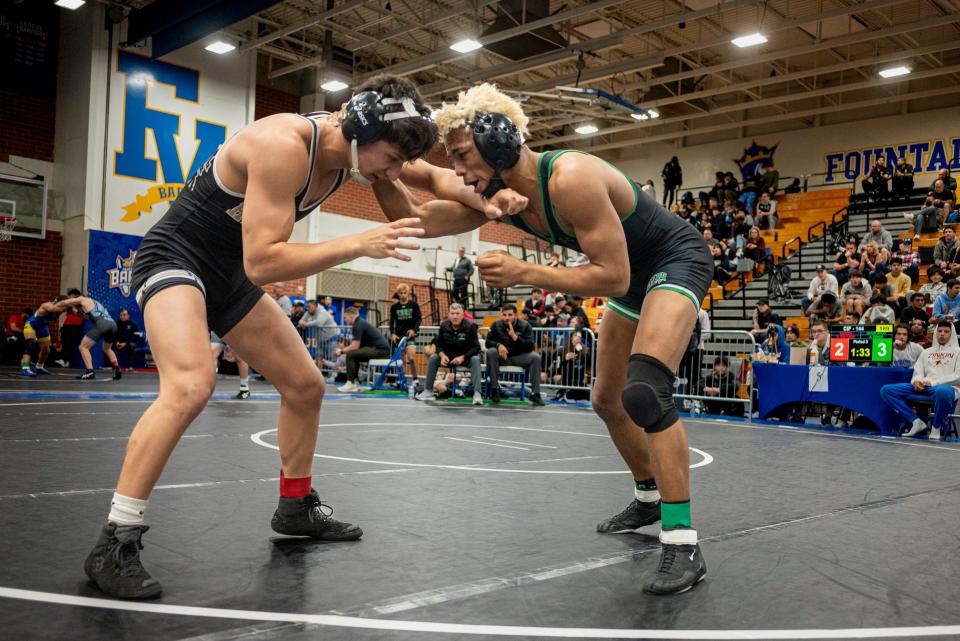 Victor Valley’s Avian Singh and Hesperia’s Angel Salgado face off during the 144-pound title match at the CIF-Southern Section Inland Division Individual Championships, hosted by Fountain Valley High School, on Saturday, Feb. 10, 2024. Singh captured the 144-pound title.