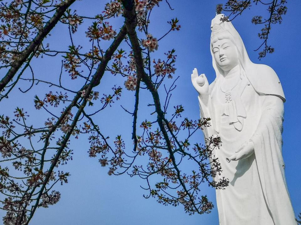 A statue of the bodhisattva Guanyin in Japan. <a href="https://www.gettyimages.com/detail/photo/guanyin-statue-in-funaoka-shibata-tohoku-japan-royalty-free-image/951112614?adppopup=true" rel="nofollow noopener" target="_blank" data-ylk="slk:kampee patisena/Moment via Getty images;elm:context_link;itc:0;sec:content-canvas" class="link ">kampee patisena/Moment via Getty images</a>