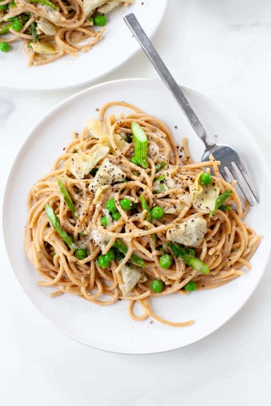 <p>Kara Lydon Nutrition</p><p>This pasta is a spin on cacio e pepe, super cheesy and peppery, piled high with fresh spring veggies like asparagus, peas and artichokes!</p><p><strong>Get the recipe: <a href="https://karalydon.com/healthy-eating/spring-recipe-peppery-pasta-with-asparagus-fava-cacio-e-pepe/" rel="nofollow noopener" target="_blank" data-ylk="slk:Spring Vegetable Pasta;elm:context_link;itc:0;sec:content-canvas" class="link ">Spring Vegetable Pasta</a></strong></p>