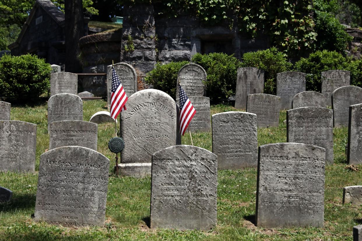 "The Legend of Sleepy Hollow" author Washington Irving's gravesite is marked by American flags June 1, 2023 in the historic Sleepy Hollow Cemetery.