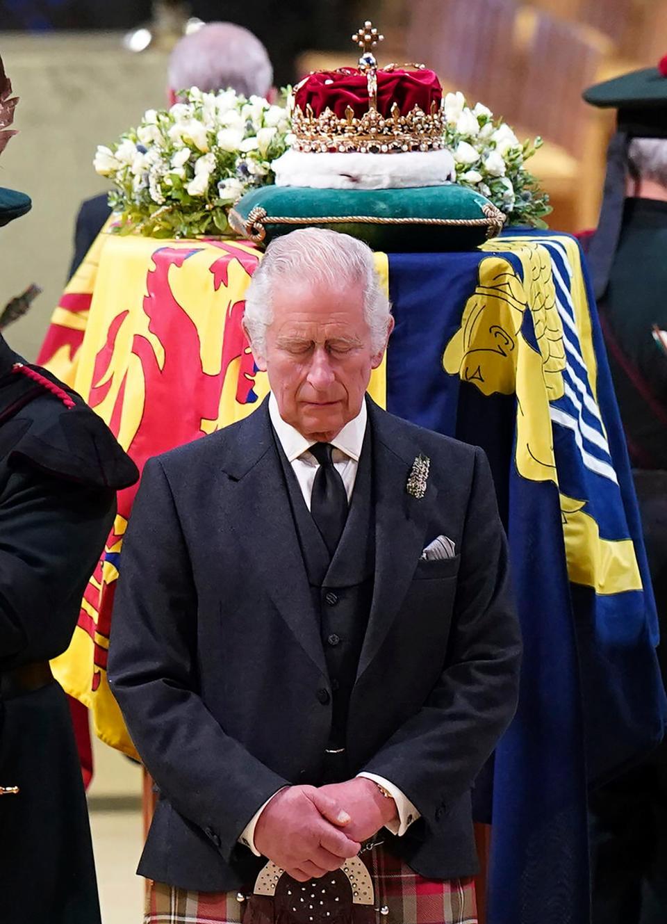 Britain's King Charles III, center, and other members of the royal family hold a vigil at the coffin of Queen Elizabeth II at St Giles' Cathedral, Edinburgh, Scotland, Monday Sept. 12, 2022.