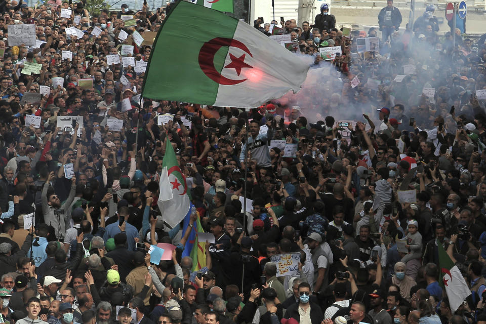 FILE - In this April 2, 2021 file photo, demonstrators take to the street of Algiers. Two years after it ousted Algeria’s long-serving leader, the country’s pro-democracy movement is at a crossroads. There are fears it’s been infiltrated by a group with links to an Islamist party outlawed during a dark era of strife in the 1990s. (AP Photo/ Fateh Guidoum, file)