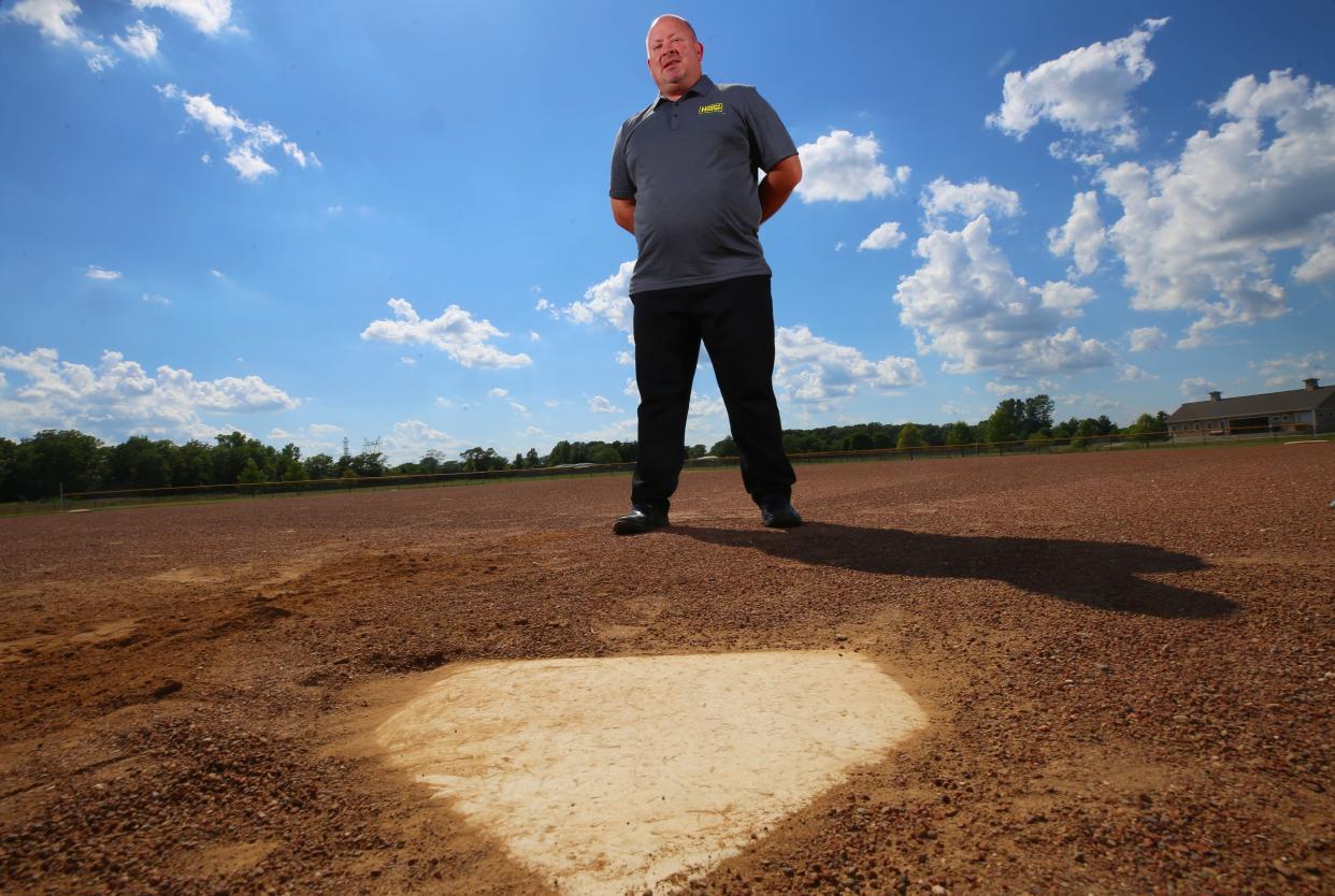 Eric Saxton, Grove City Alumni Softball Tournament director, stands in front of home plate at the Fryer Park diamond in Grove City. The Grove City Alumni Softball Tournament returns July 30 and 31 on the diamonds at Murfin Memorial Fields, Fryer Park and Our Lady of Perpetual Hope Church.