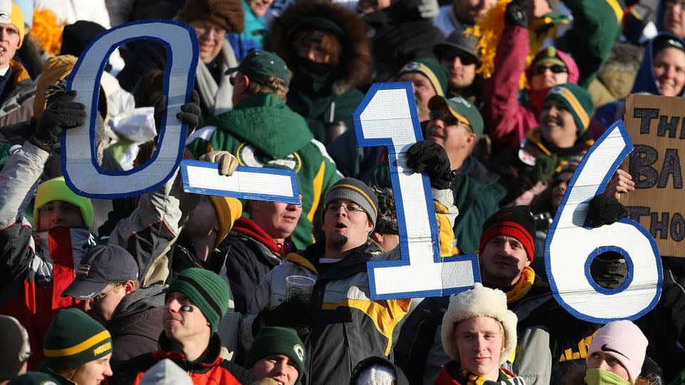 Lions fans hold up signs indicating the impending 0-16 record of their team during their season-ending game against the Green Bay Packers in 2008. The Packers defeated the Lions 31-21. - Jonathan Daniel/Getty Images