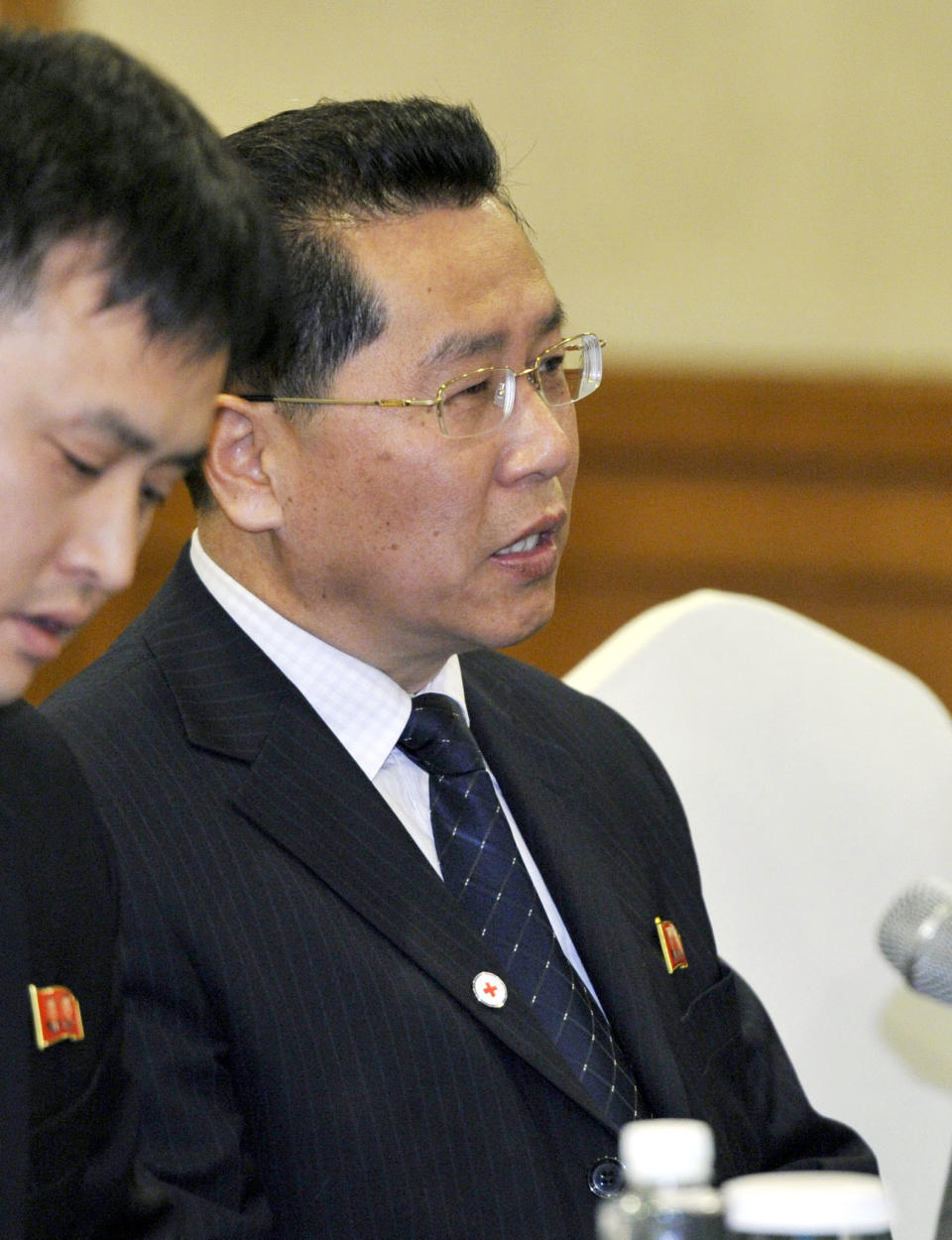 Ri Ho Rim, secretary general of North Korea's Red Cross Society, speaks during a meeting with Osamu Tasaka, director general of the International Department at the Japanese Red Cross, in Shenyang, China, Monday, March 3, 2014. The North Korean and Japanese Red Cross officials met in China to discuss the repatriation of remains of Japanese buried in North Korea and left behind after World War II. (AP Photo/Kyodo News) JAPAN OUT, CREDIT MANDATORY