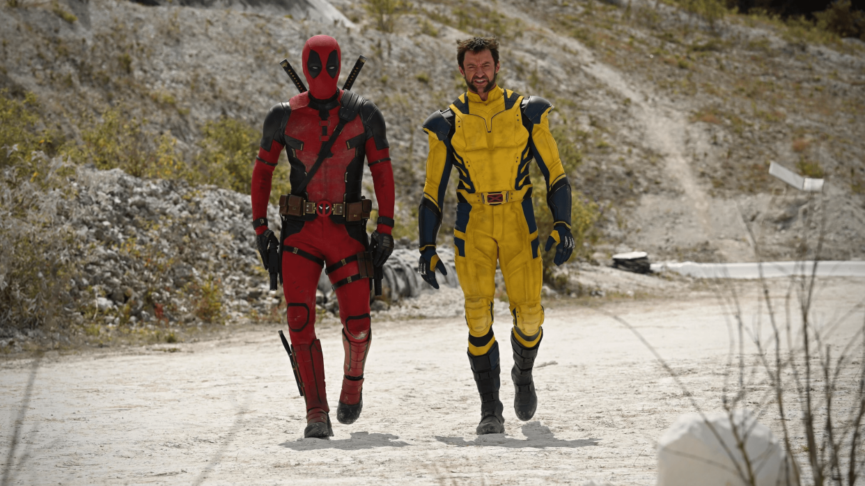  (L, R) Deadpool and Hugh Jackman as Wolverine, walking on a dirt road in "Deadpool & Wolverine". 