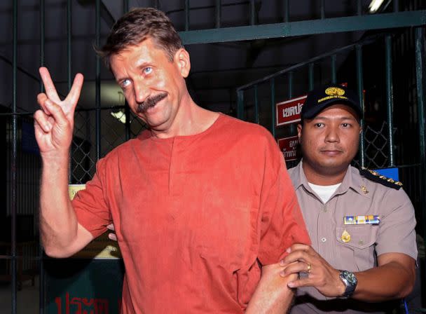 PHOTO: Russian alleged arms dealer Viktor Bout shows a victory sign after his verdict at the Criminal Court in Bangkok on August 11, 2009. (Pornchai Kittiwongsakul/AFP via Getty Images, FILE)