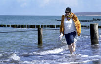 Simone Ravera, patient of the 'MEDIAN Clinic Heiligendamm', makes exercises after an interview with the Associated Press in Heiligendamm, northern Germany, Wednesday, April 14, 2021. The MEDIAN Clinic, specialized on lung diseases, treats COVID-19 long time patients from all over Germany. (AP Photo/Michael Sohn)