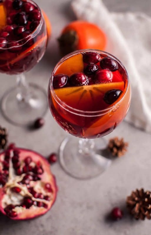 <p>Salt & Lavender</p><p>Winter bounty in a pitcher. </p><p><strong>Get the recipe: <a href="https://www.saltandlavender.com/pomegranate-persimmon-winter-sangria/" rel="nofollow noopener" target="_blank" data-ylk="slk:Pomegranate and Persimmon Winter Sangria;elm:context_link;itc:0;sec:content-canvas" class="link rapid-noclick-resp">Pomegranate and Persimmon Winter Sangria</a></strong></p>