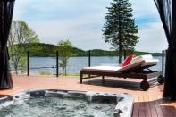 <p>Outside the home, the deck is the perfect place to soak up some sun. There’s also a hot tub to ease away your aches and pains. (Keller Williams Capital Realty) </p>